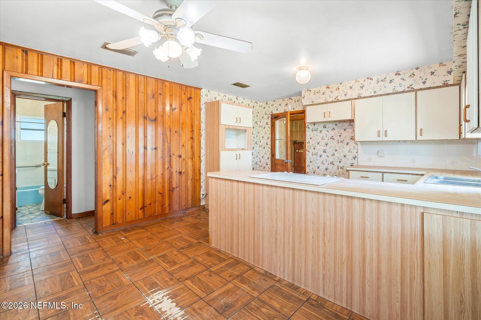 786 West River Road Palatka, FL 32177 - Photo 18 of 53 a view of a hallway with a window and a kitchen