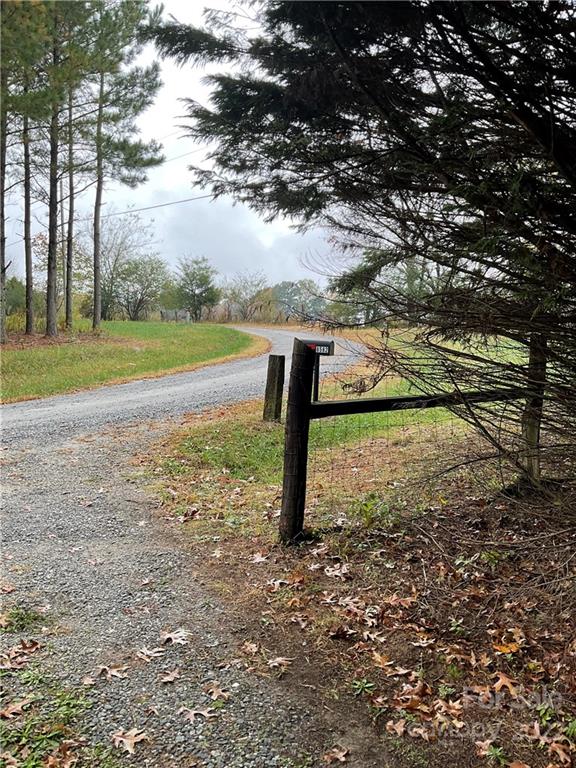 8582 Jc Road Vale, NC 28168 - Photo 2 of 15 a view of a yard with a tree