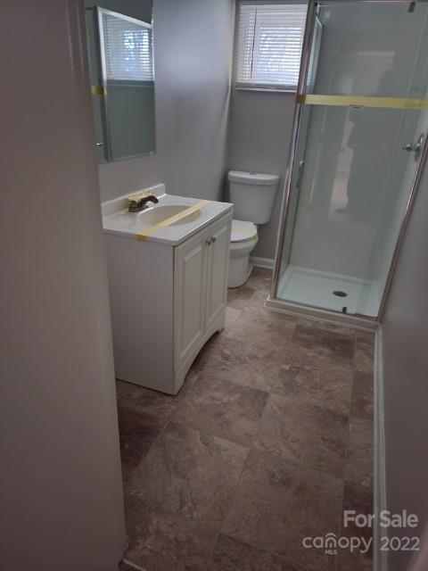 8582 Jc Road Vale, NC 28168 - Photo 8 of 15 a bathroom with a sink toilet and mirror