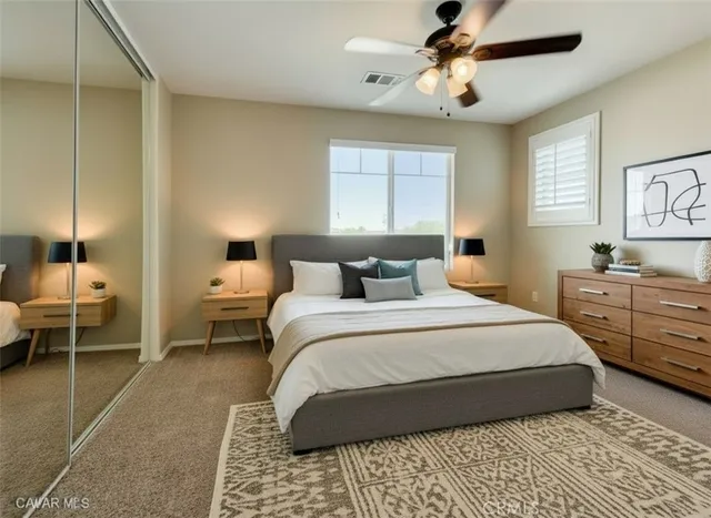 a bedroom with bed and window