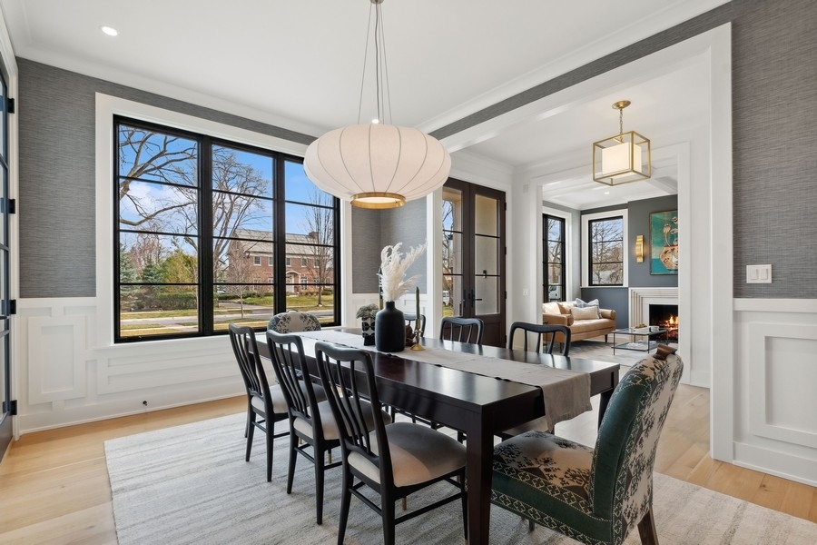240 Raleigh Road Kenilworth, IL 60043 - Photo 11 of 71 a view of a dining room with furniture window and wooden floor