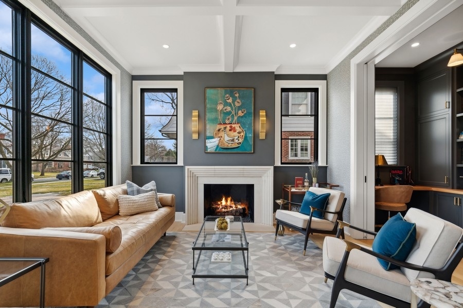 240 Raleigh Road Kenilworth, IL 60043 - Photo 12 of 71 a living room with furniture and a fireplace