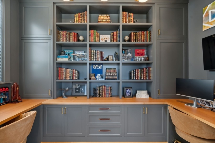 240 Raleigh Road Kenilworth, IL 60043 - Photo 13 of 71 a room with a bookshelf and a shelf