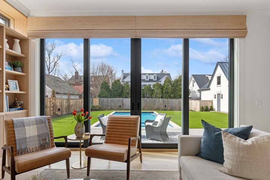 240 Raleigh Road Kenilworth, IL 60043 - Photo 19 of 71 a living room with furniture and a large window