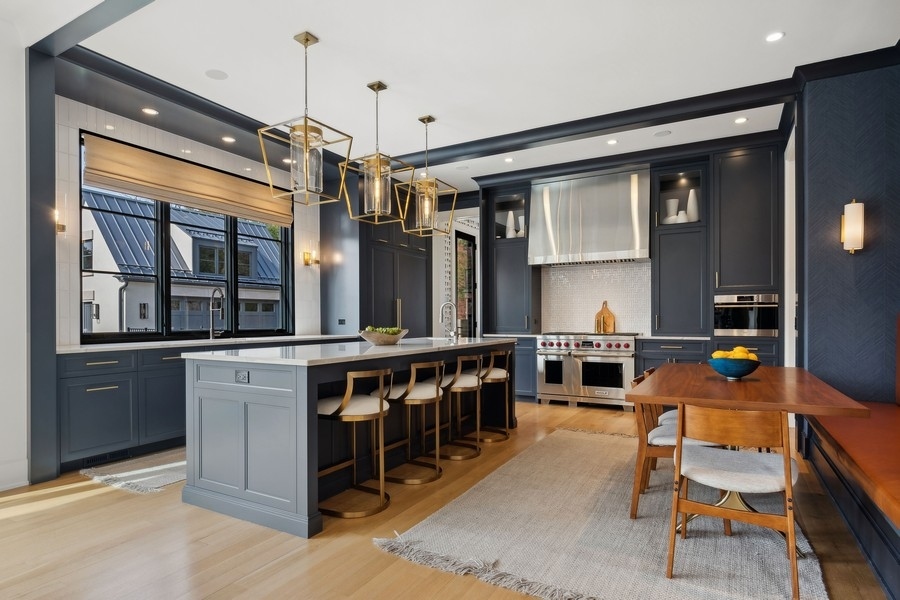 240 Raleigh Road Kenilworth, IL 60043 - Photo 26 of 71 a kitchen with stainless steel appliances granite countertop a stove and a sink