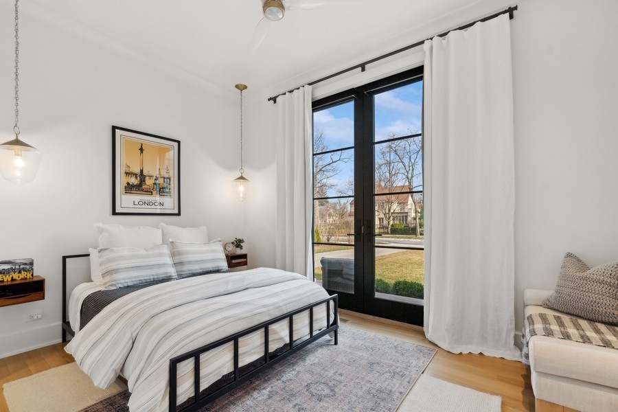 240 Raleigh Road Kenilworth, IL 60043 - Photo 30 of 71 a bedroom with a bed and a window