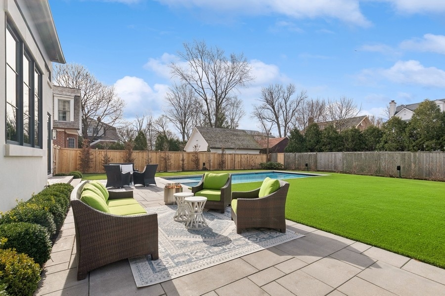 240 Raleigh Road Kenilworth, IL 60043 - Photo 3 of 71 a view of a patio with couches and a fire pit