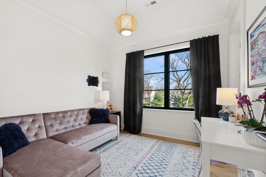 240 Raleigh Road Kenilworth, IL 60043 - Photo 46 of 71 a living room with furniture and a large window