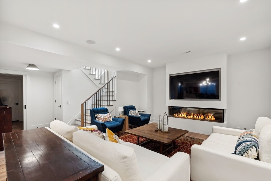 240 Raleigh Road Kenilworth, IL 60043 - Photo 49 of 71 a living room with furniture and a flat screen tv