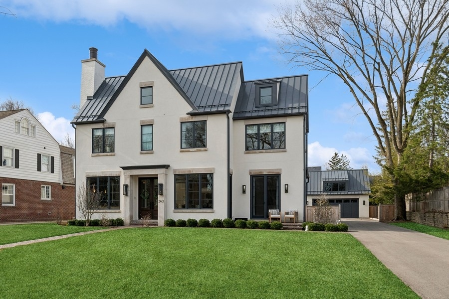 240 Raleigh Road Kenilworth, IL 60043 - Photo 66 of 71 a front view of a house with a yard