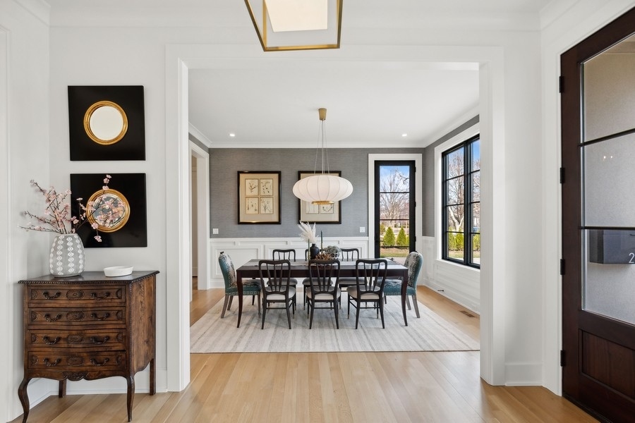 240 Raleigh Road Kenilworth, IL 60043 - Photo 8 of 71 a view of a a dining room with furniture window and wooden floor