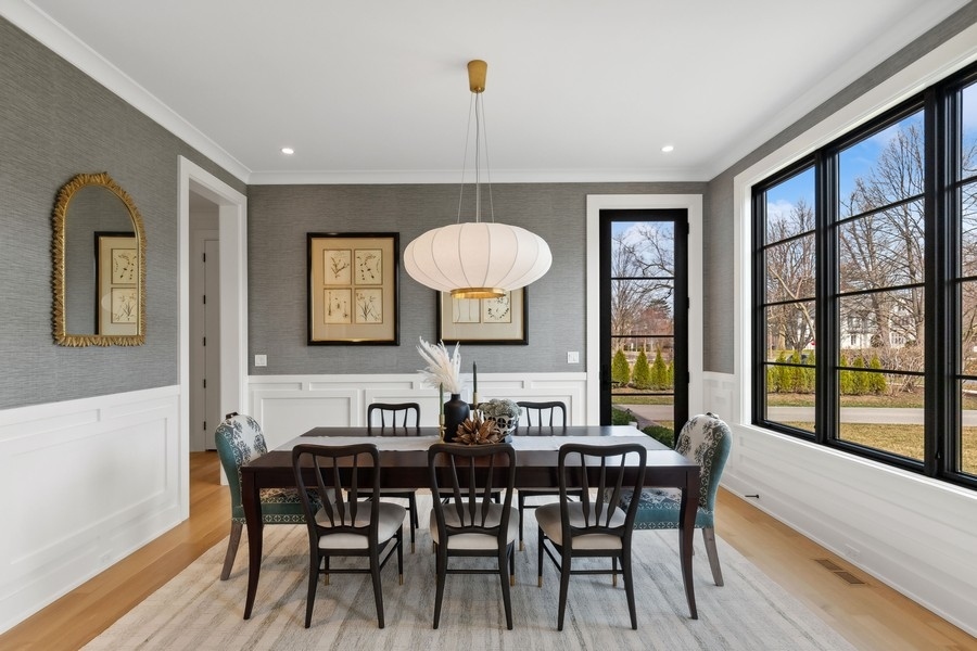 240 Raleigh Road Kenilworth, IL 60043 - Photo 9 of 71 a view of a dining room with furniture window and wooden floor