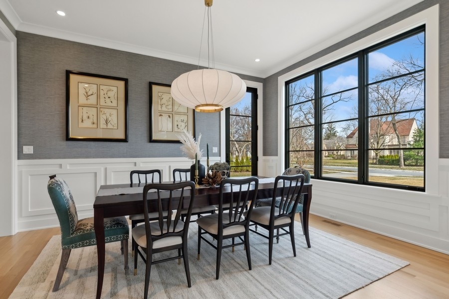 240 Raleigh Road Kenilworth, IL 60043 - Photo 10 of 71 a view of a dining room with furniture window and wooden floor