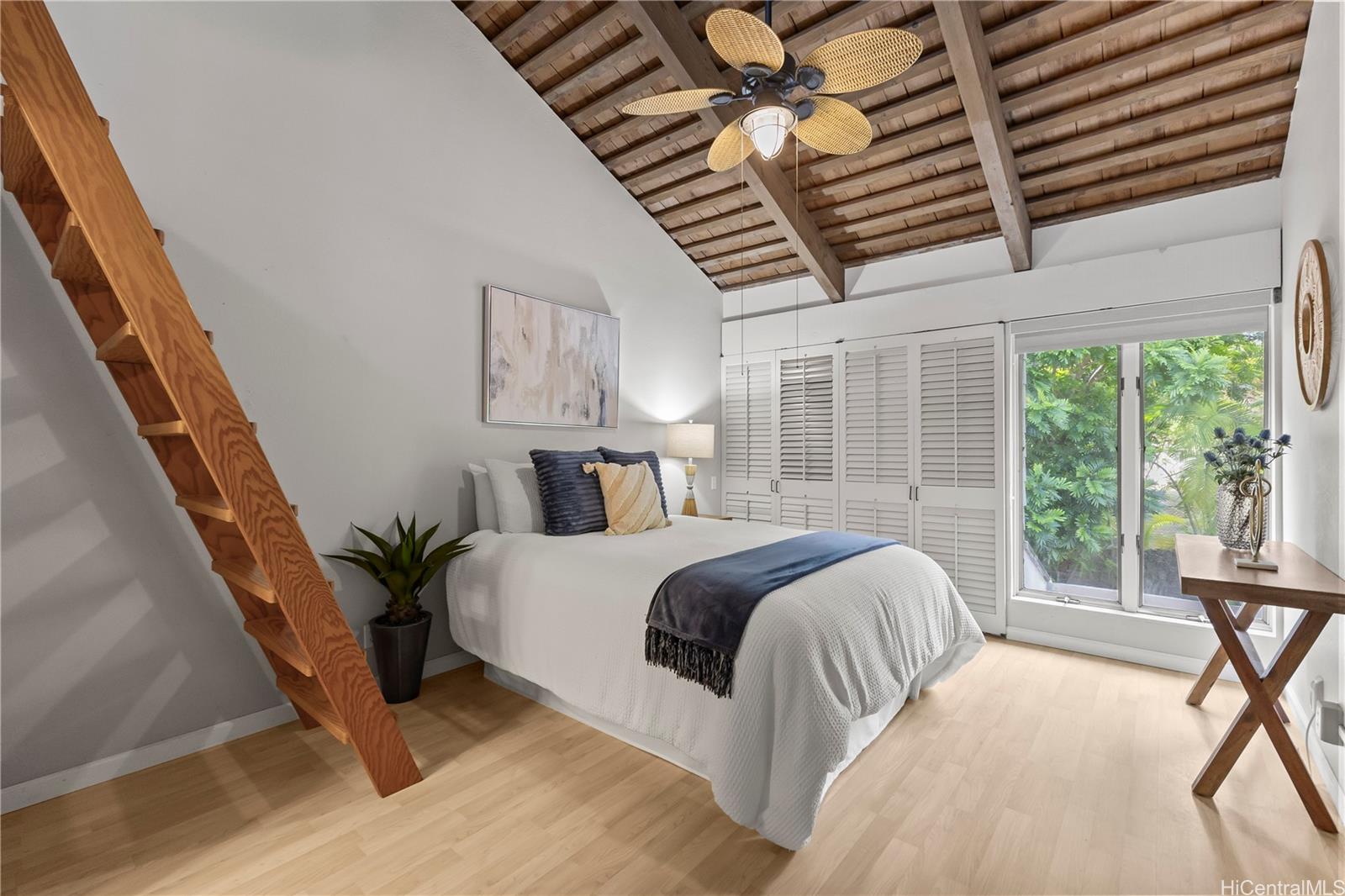 445 Kawailoa Road, Unit 8 Kailua, HI 96734 - Photo 13 of 25 a bedroom with a large bed and a large window