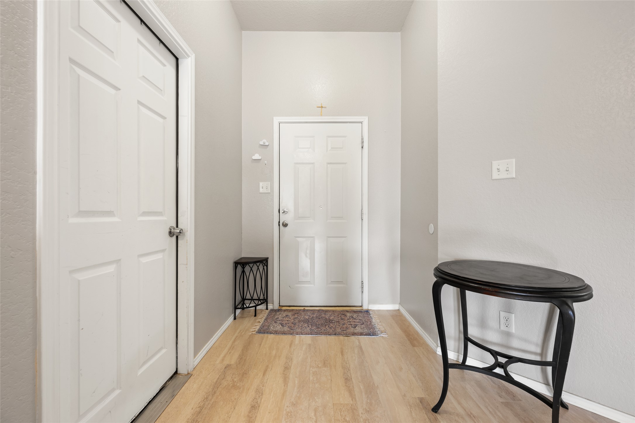 144 Calcite Lane Jarrell, TX 76537 - Photo 5 of 38 Enter into a welcoming foyer with smooth laminate flooring, setting a pristine tone for this residence.