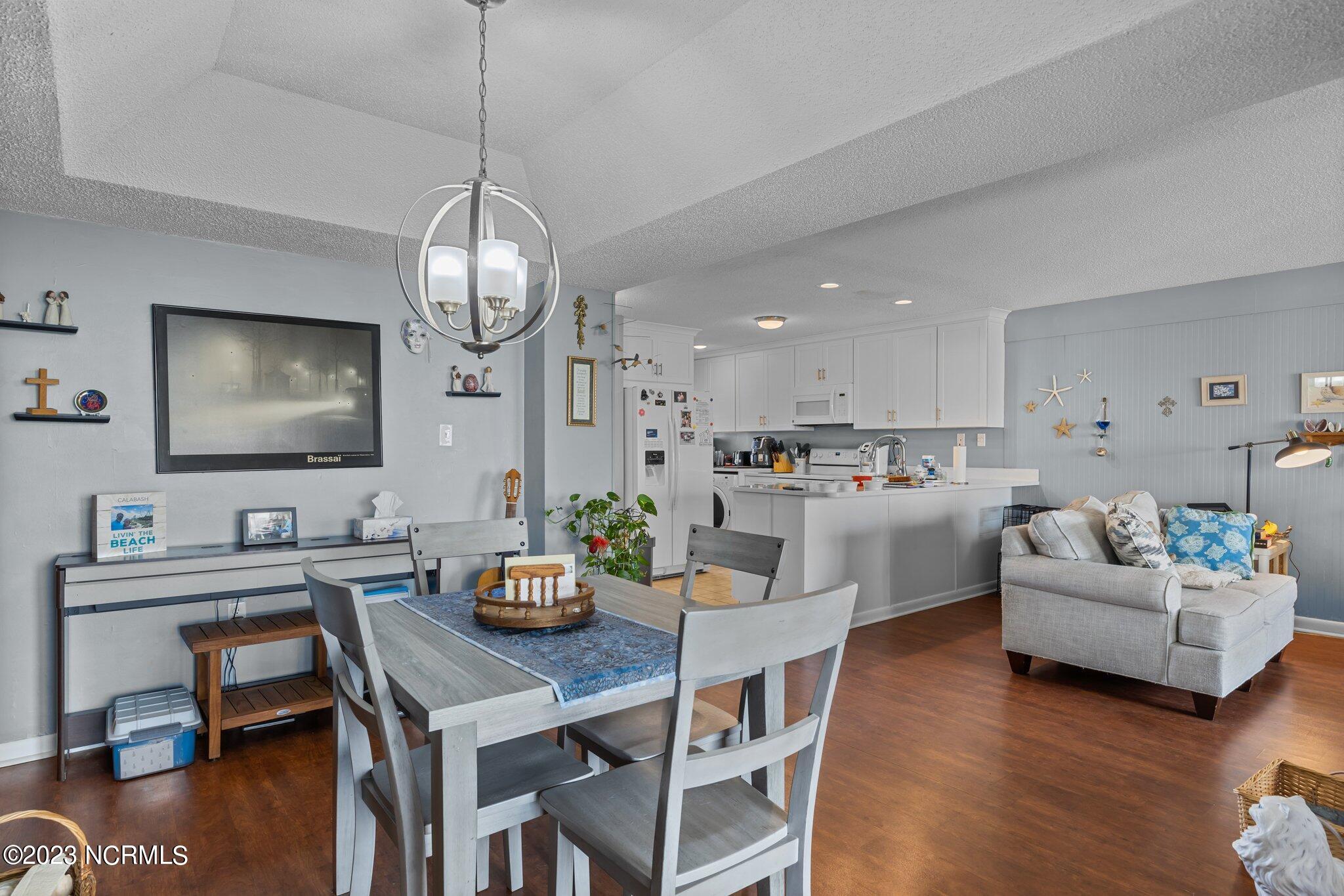 1505 Salter Path Road, Unit 238 Indian Beach, NC 28512 - Photo 15 of 49 Dining room with view of living room and kitchen