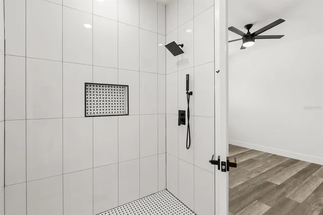 a view of a room with wooden floor