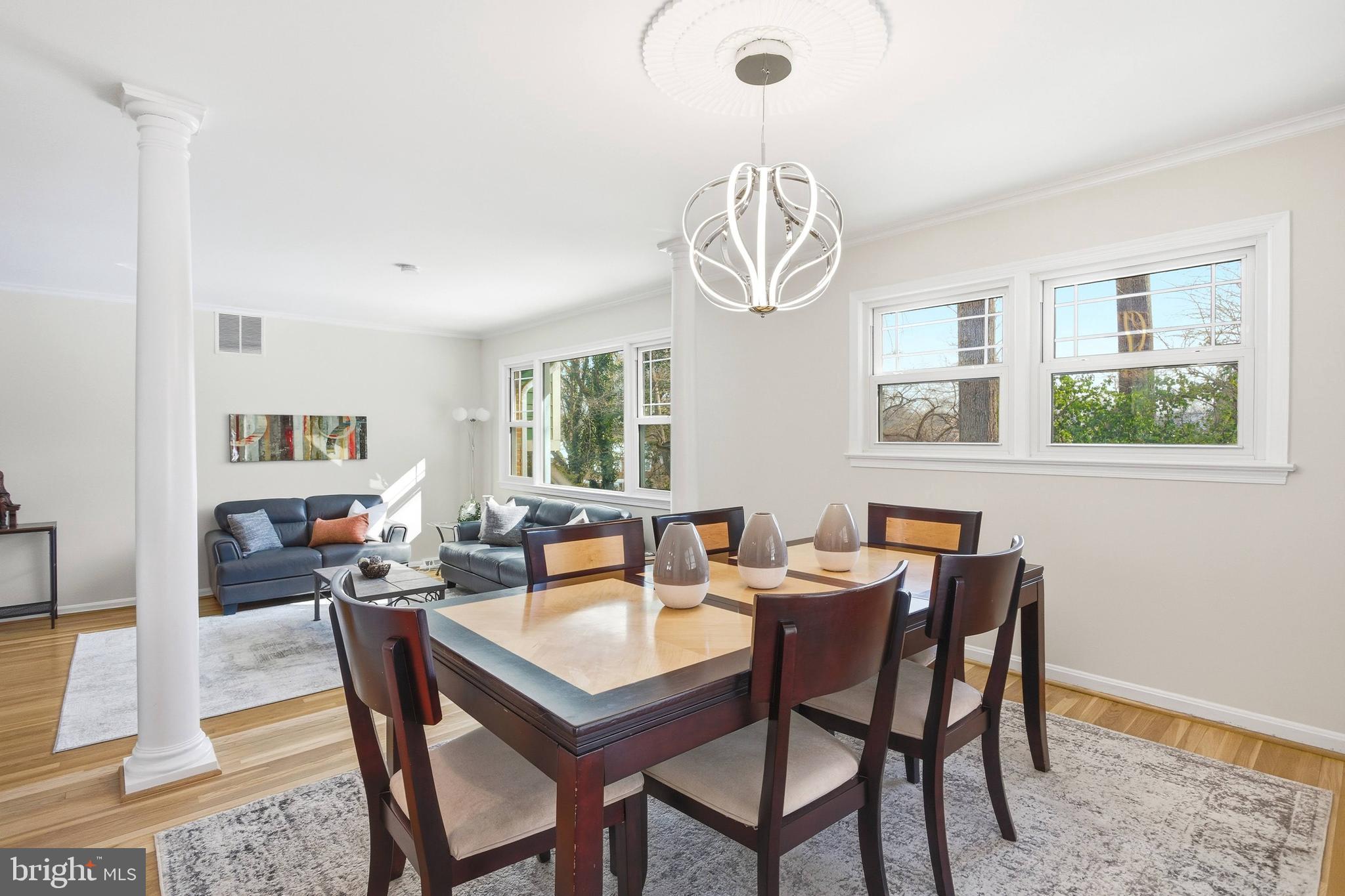 521 Creek Crossing Road Northeast Vienna, VA 22180 - Photo 13 of 63 a view of a dining room with furniture window and wooden floor