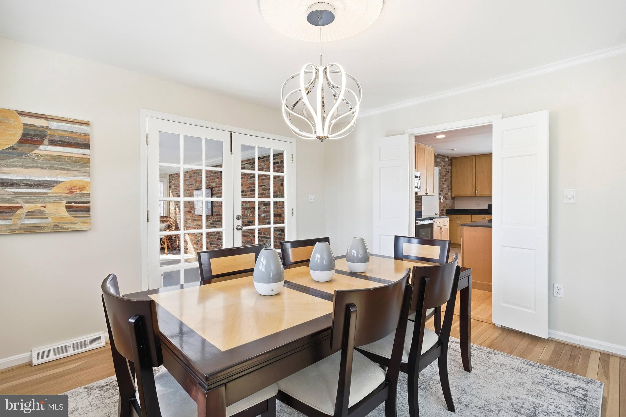 521 Creek Crossing Road Northeast Vienna, VA 22180 - Photo 14 of 63 a view of a dining room with furniture window and wooden floor
