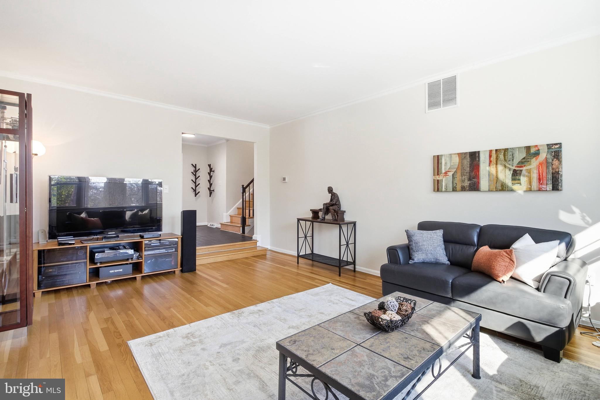 521 Creek Crossing Road Northeast Vienna, VA 22180 - Photo 17 of 63 a living room with furniture and a flat screen tv