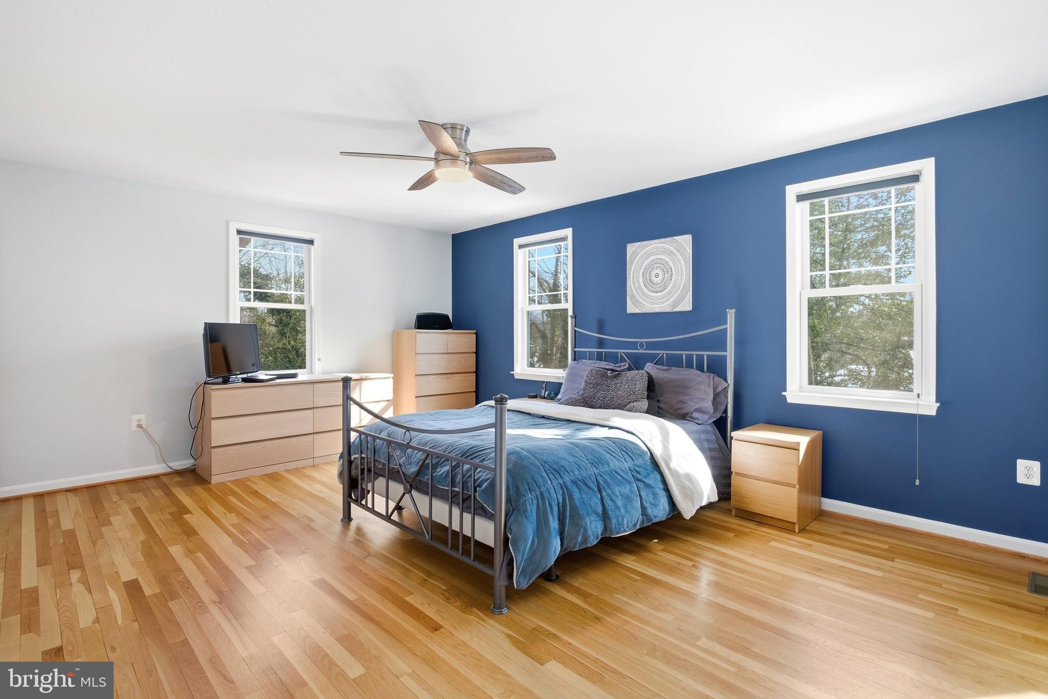 521 Creek Crossing Road Northeast Vienna, VA 22180 - Photo 29 of 63 a bedroom with a bed and wooden floor