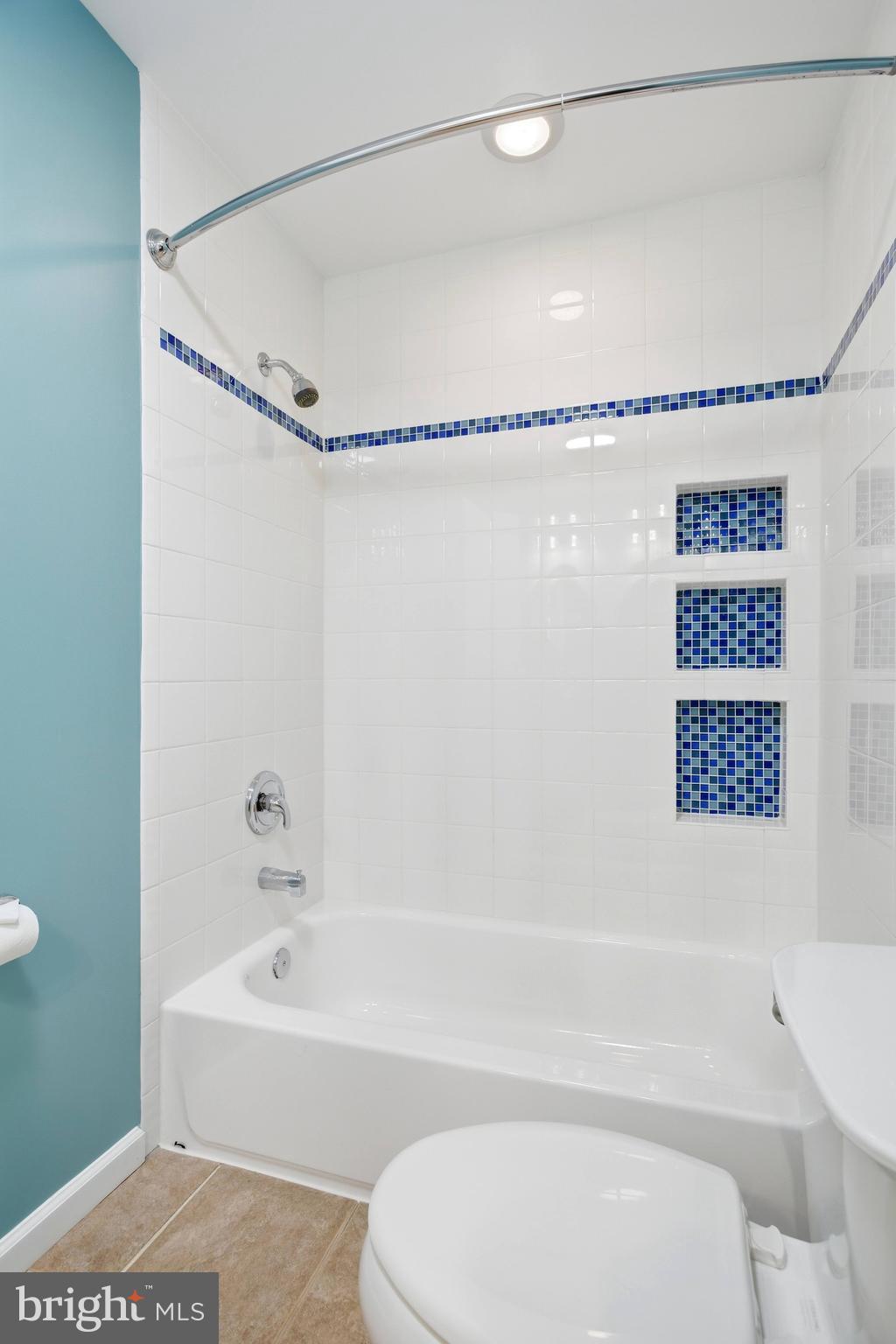 521 Creek Crossing Road Northeast Vienna, VA 22180 - Photo 38 of 63 a bathroom with a shower a bath tub and a shower