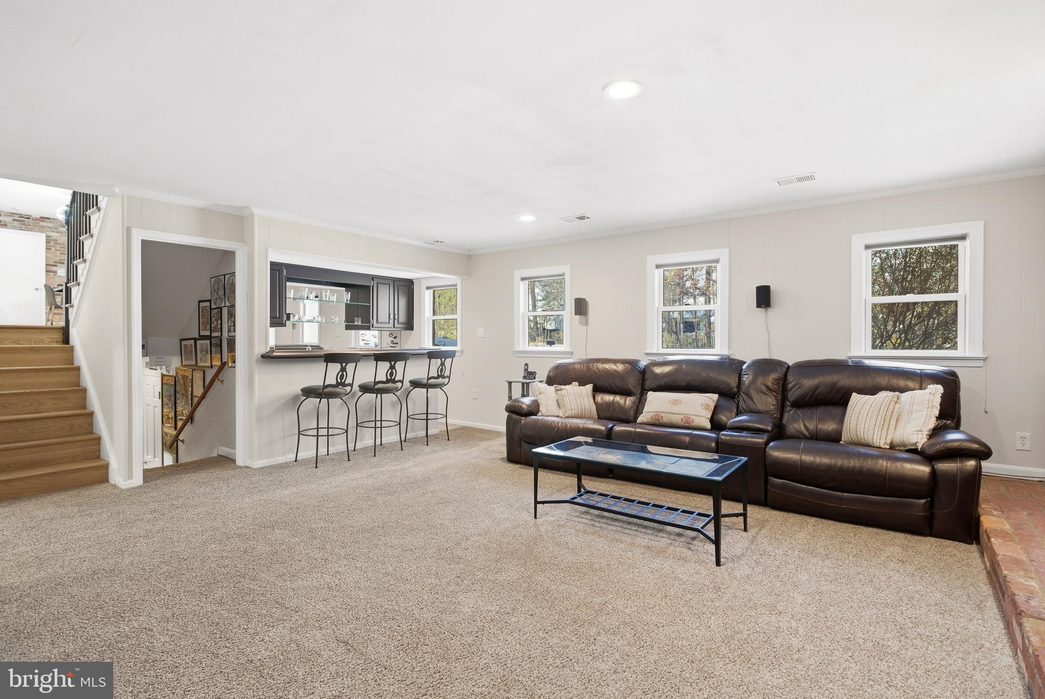 521 Creek Crossing Road Northeast Vienna, VA 22180 - Photo 42 of 63 a living room with furniture and a table
