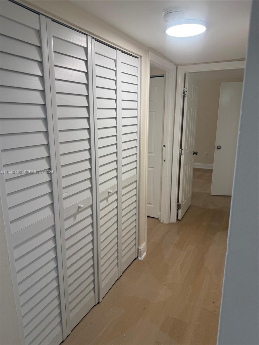 484 Northwest 165th St Road, Unit A512 Miami, FL 33169 - Photo 13 of 16 a view of closet area