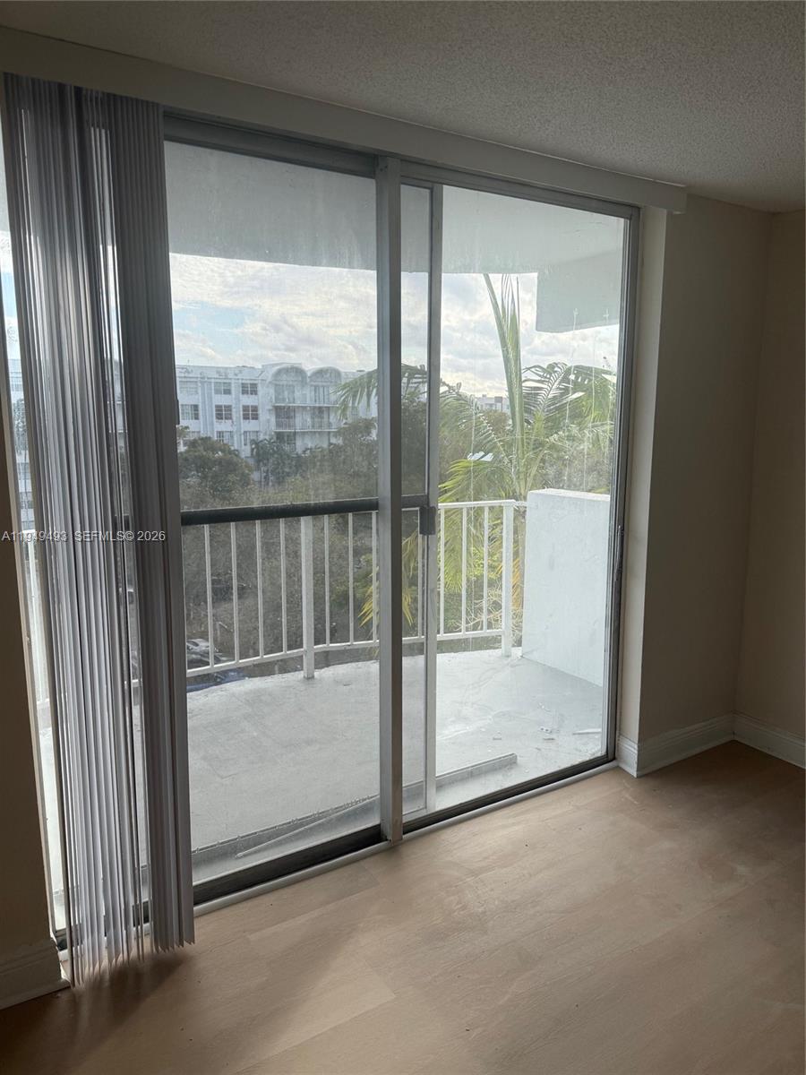 484 Northwest 165th St Road, Unit A512 Miami, FL 33169 - Photo 3 of 16 a view of a room with a large window