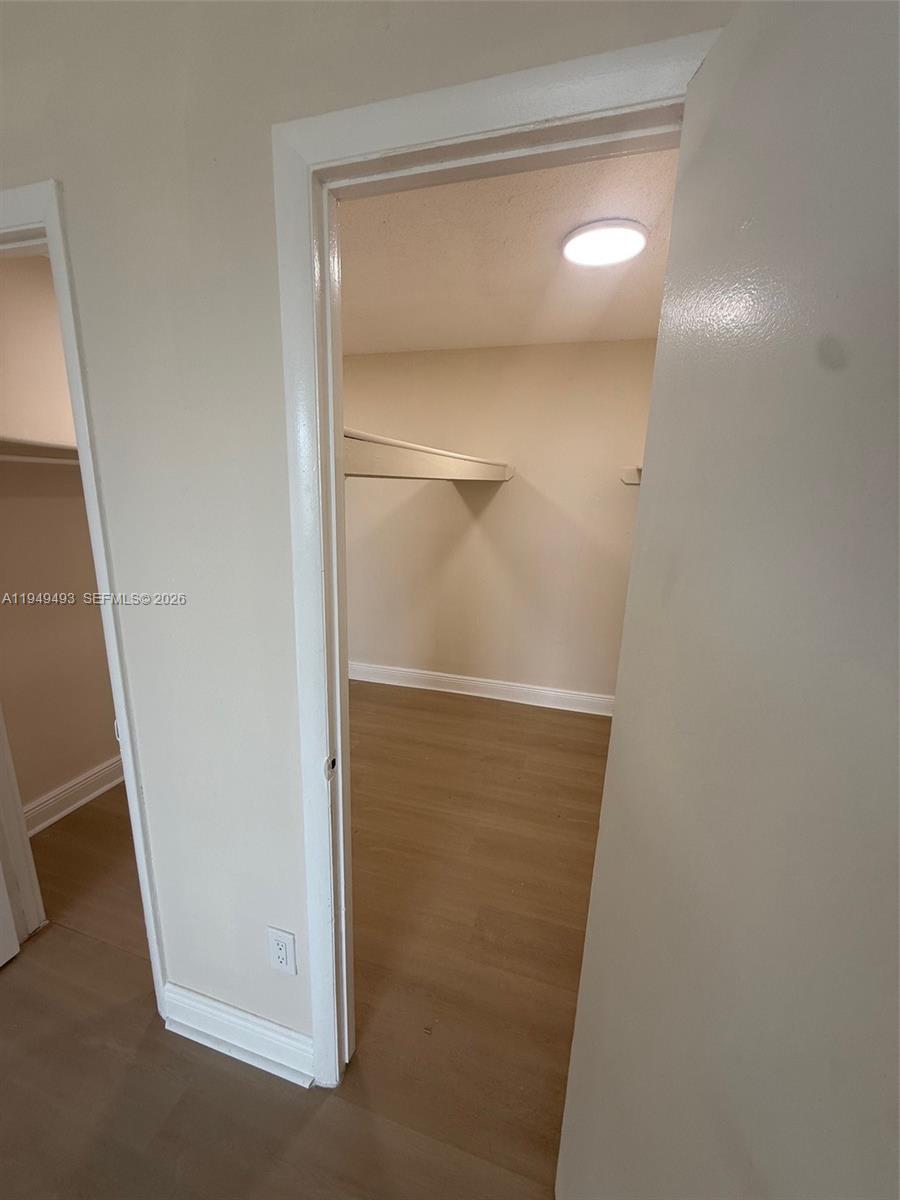 484 Northwest 165th St Road, Unit A512 Miami, FL 33169 - Photo 5 of 16 a view of closet