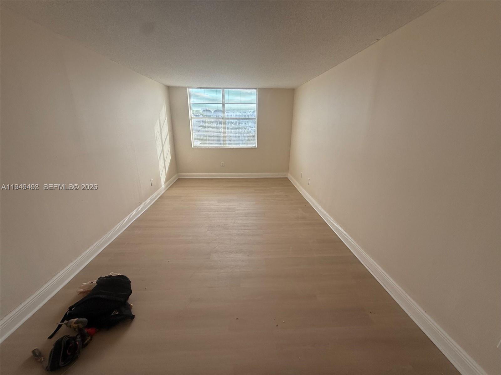 484 Northwest 165th St Road, Unit A512 Miami, FL 33169 - Photo 10 of 16 an empty room with windows