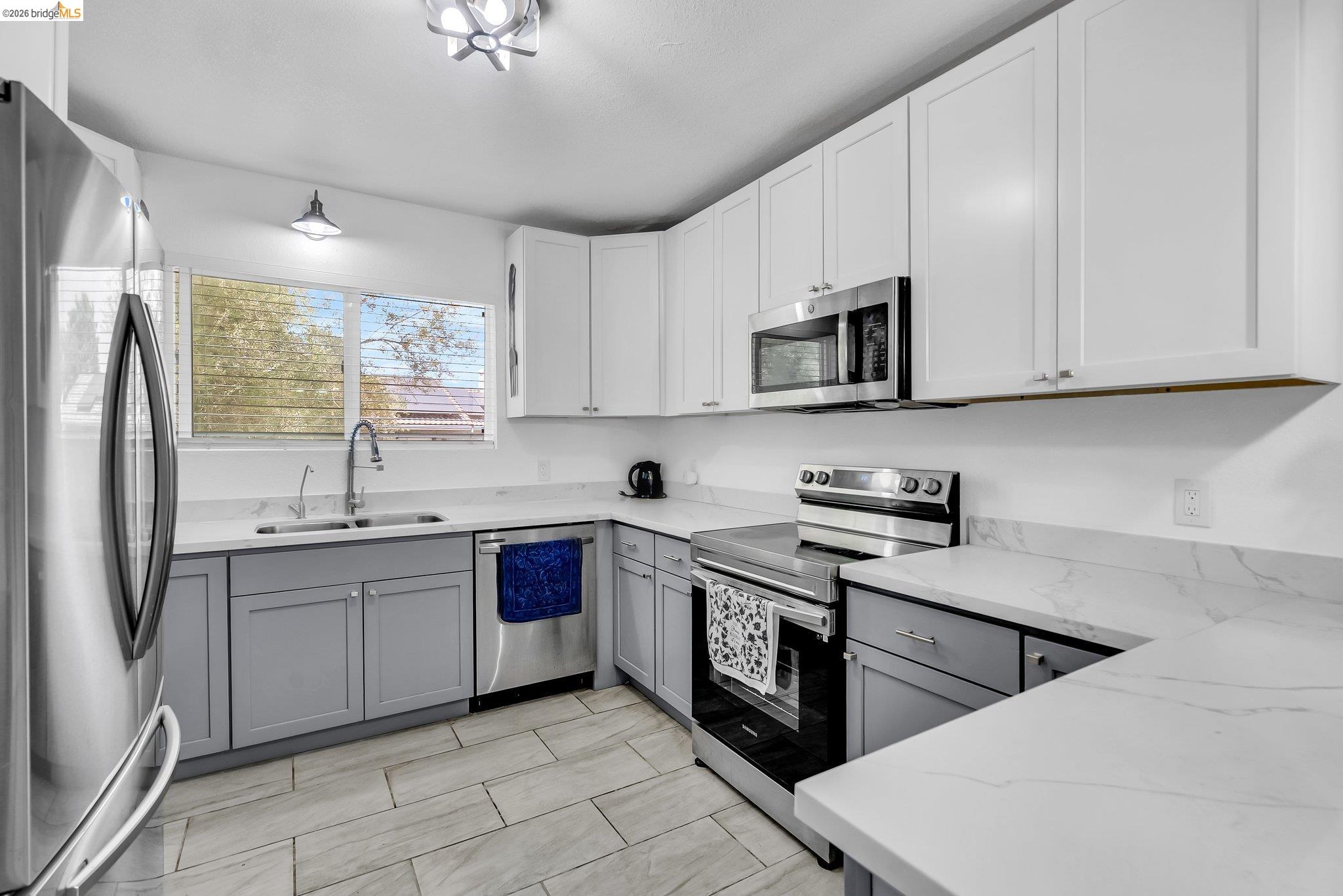 2350 West Shell Avenue Martinez, CA 94553 - Photo 15 of 39 a kitchen with stainless steel appliances granite countertop a sink a stove a refrigerator and cabinets
