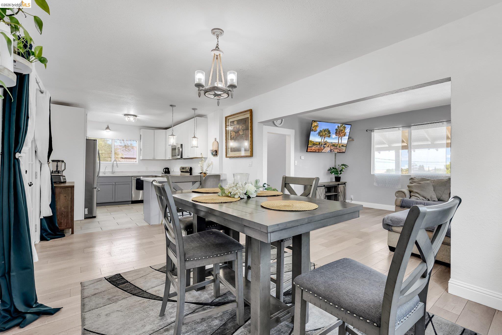 2350 West Shell Avenue Martinez, CA 94553 - Photo 17 of 39 a view of a dining room with furniture and a chandelier