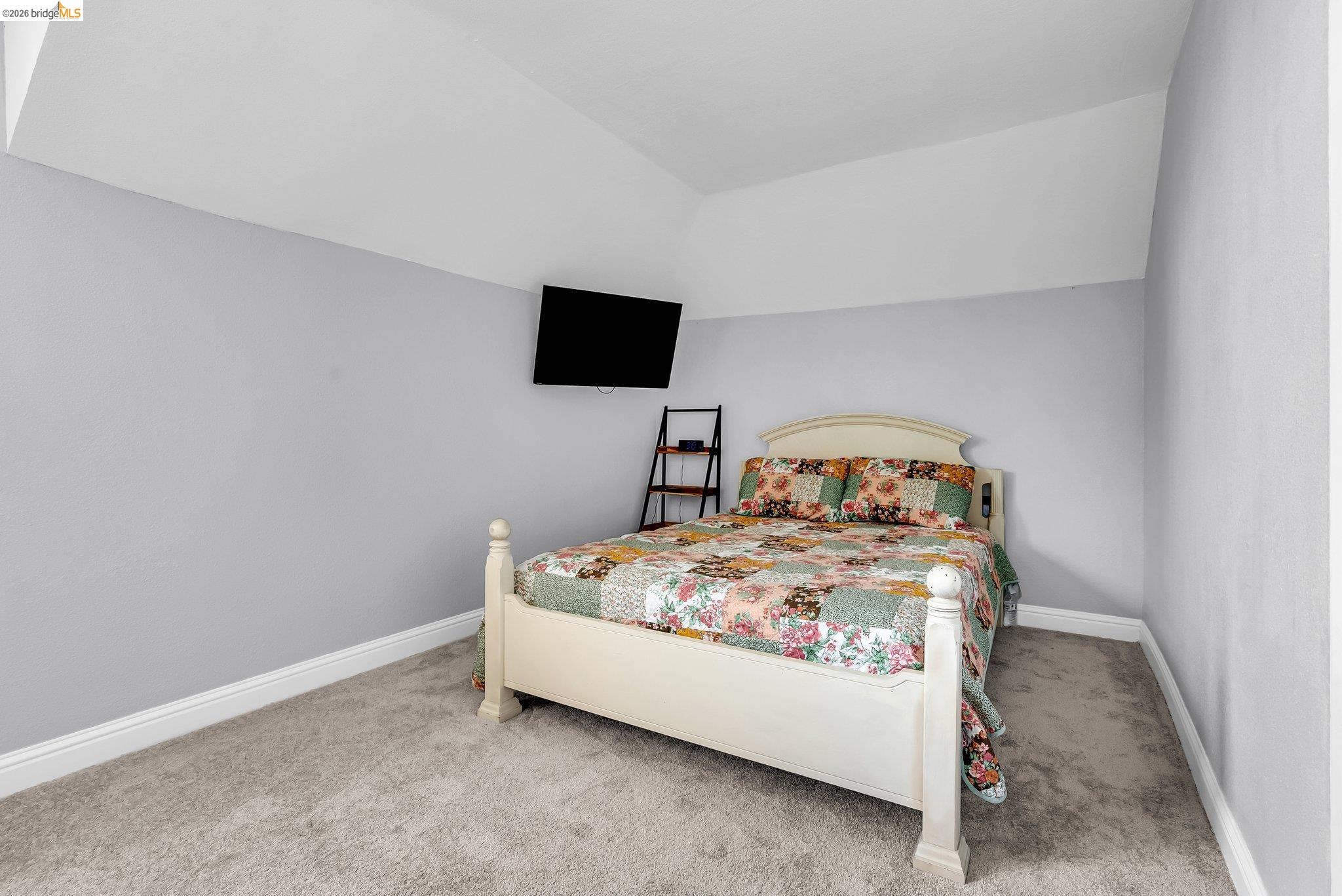 2350 West Shell Avenue Martinez, CA 94553 - Photo 24 of 39 a bedroom with a bed and a flat screen tv