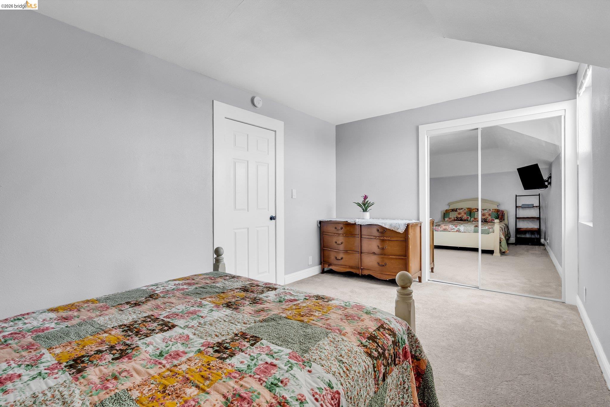 2350 West Shell Avenue Martinez, CA 94553 - Photo 25 of 39 a bedroom with a bed and a lamp
