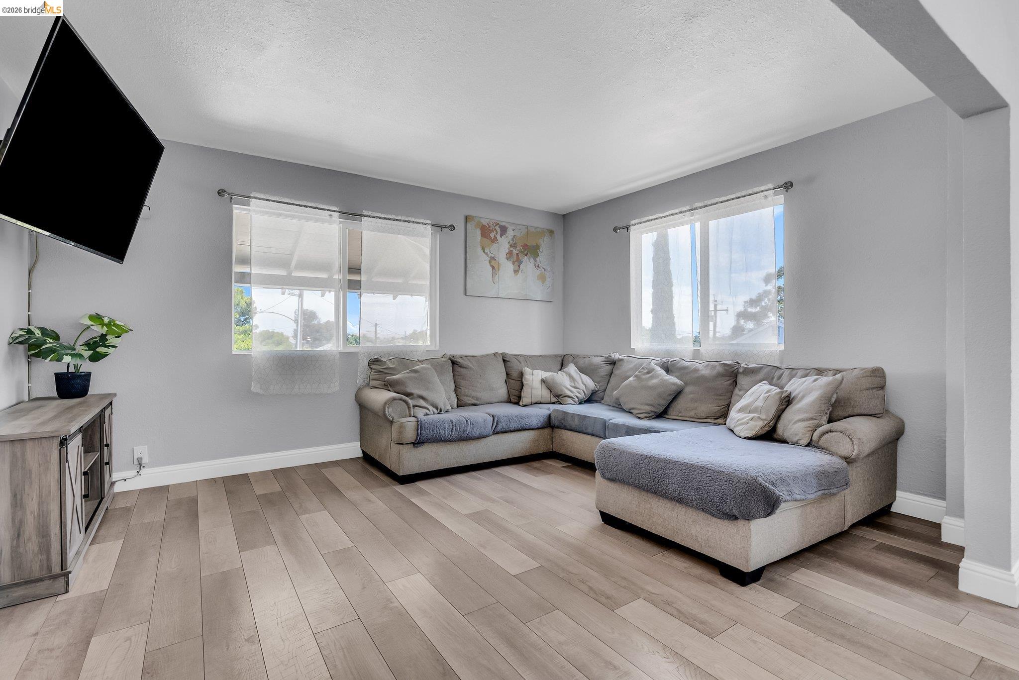 2350 West Shell Avenue Martinez, CA 94553 - Photo 3 of 39 a living room with furniture and a flat screen tv