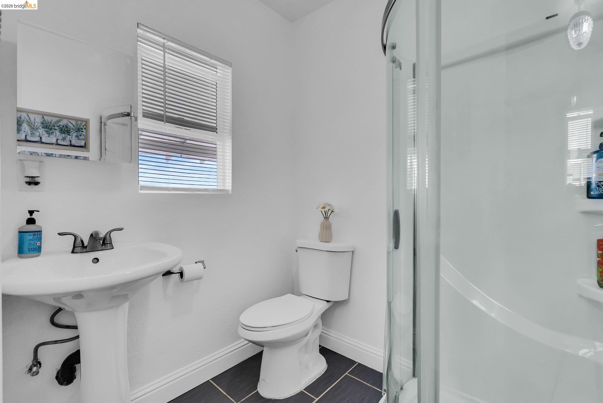 2350 West Shell Avenue Martinez, CA 94553 - Photo 5 of 39 a bathroom with a sink a toilet and shower