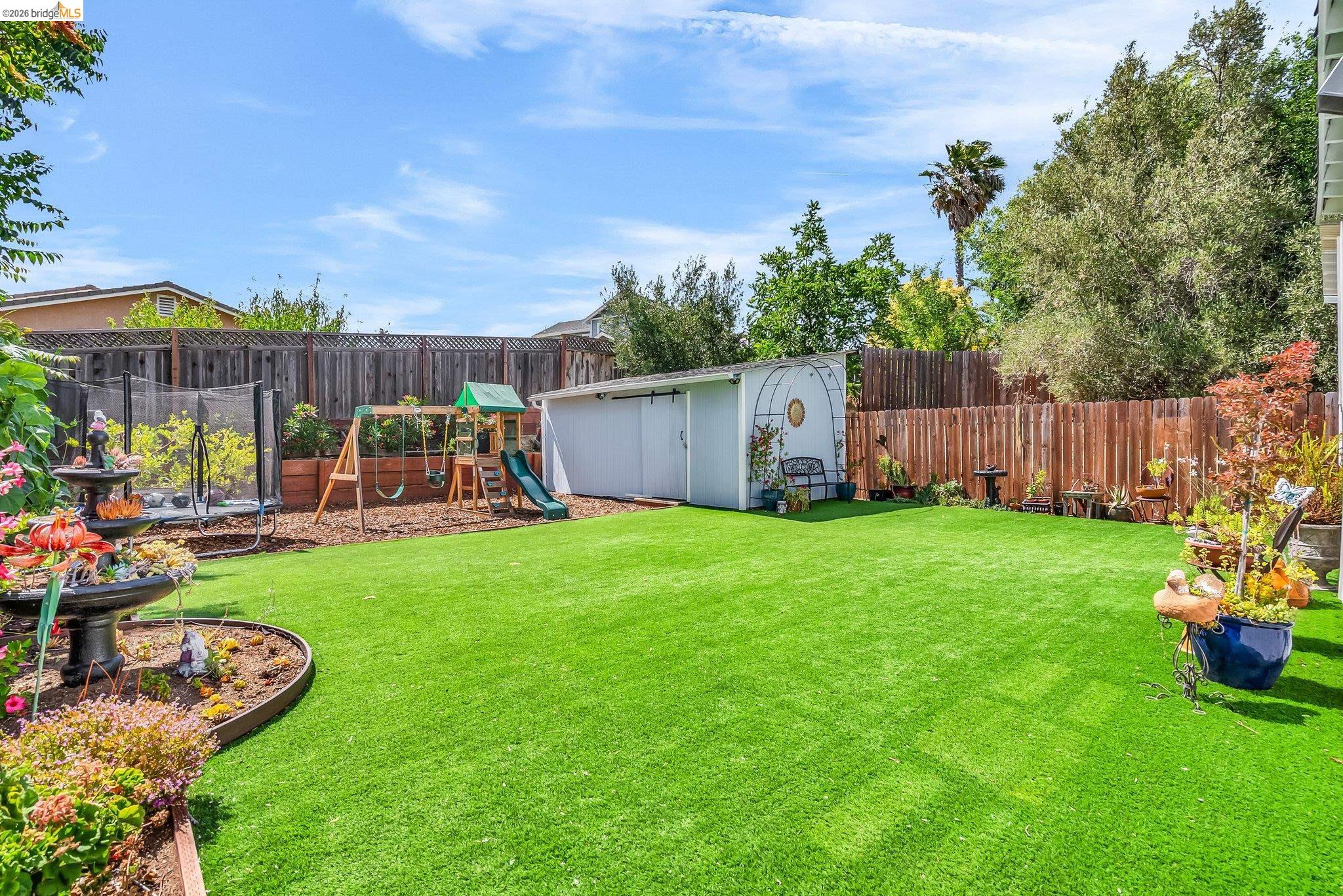 2350 West Shell Avenue Martinez, CA 94553 - Photo 8 of 39 a view of a backyard with table and chairs potted plants and wooden fence