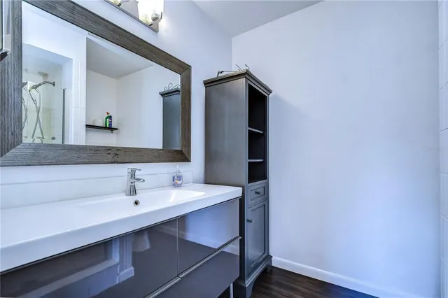 a bathroom with a sink and a mirror