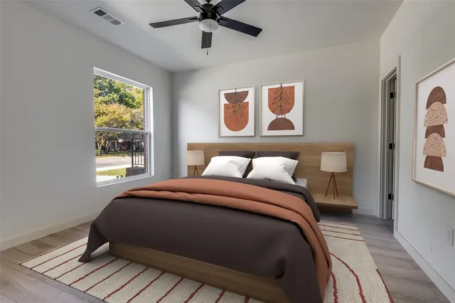 a bedroom with a bed and a window