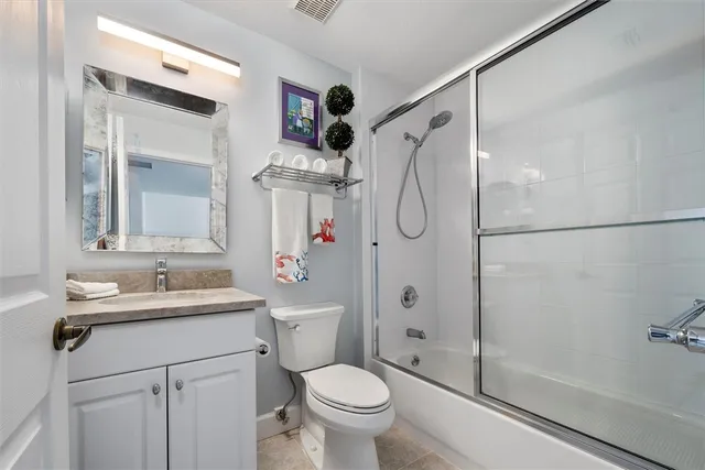 an aerial view of a houses with a yard