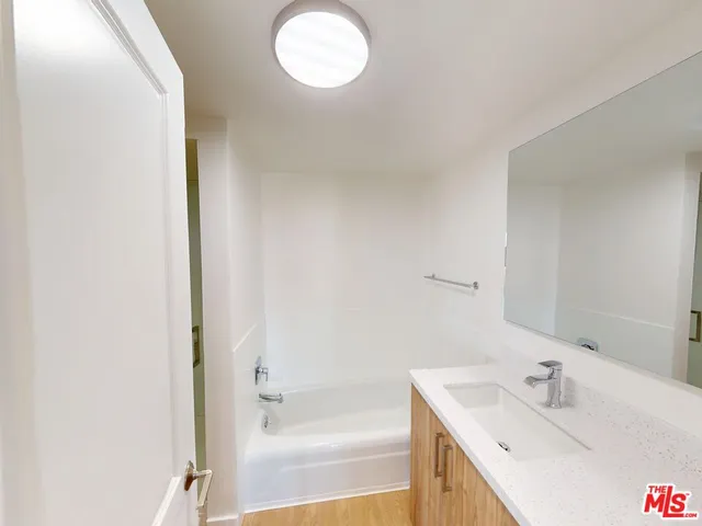 a bathroom with a bathtub and a sink