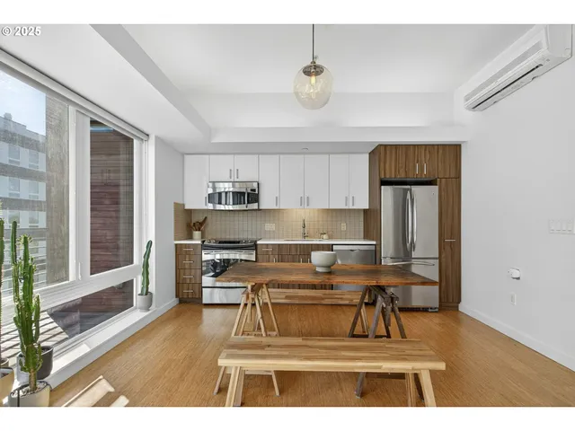 a living room with kitchen island furniture and a wooden floor