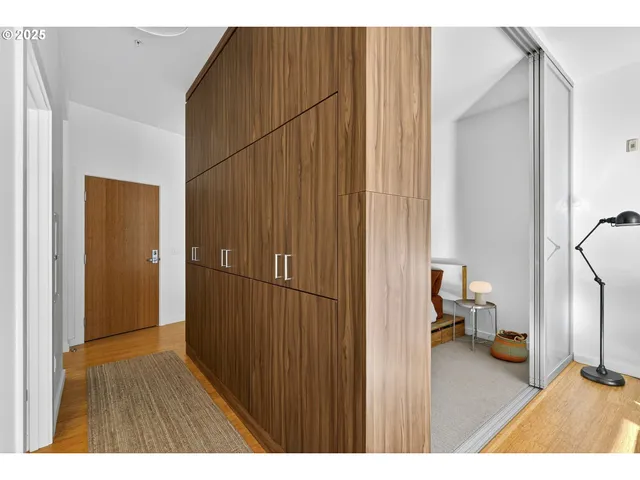 a bedroom with a bed and a lamp