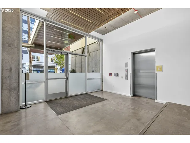 a living room with furniture and a ceiling fan