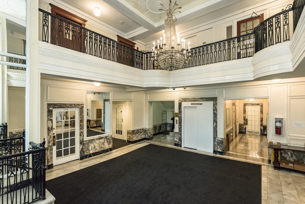 464 Commonwealth Avenue, Unit 38 Boston, MA 02215 - Photo 3 of 16 a view of a hallway with a chandelier