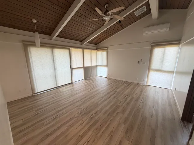 a view of a bathroom with a sink and a mirror