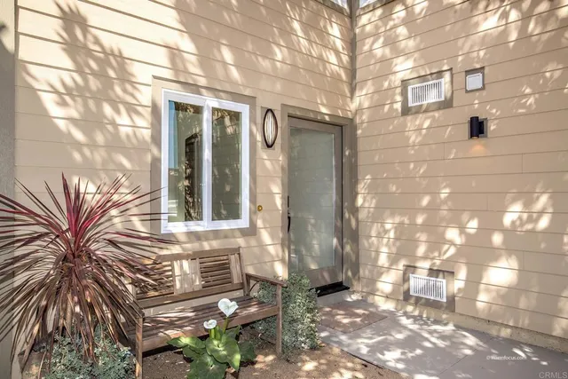 a view of a house with a tree
