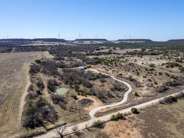 an aerial view of residential house and ocean view