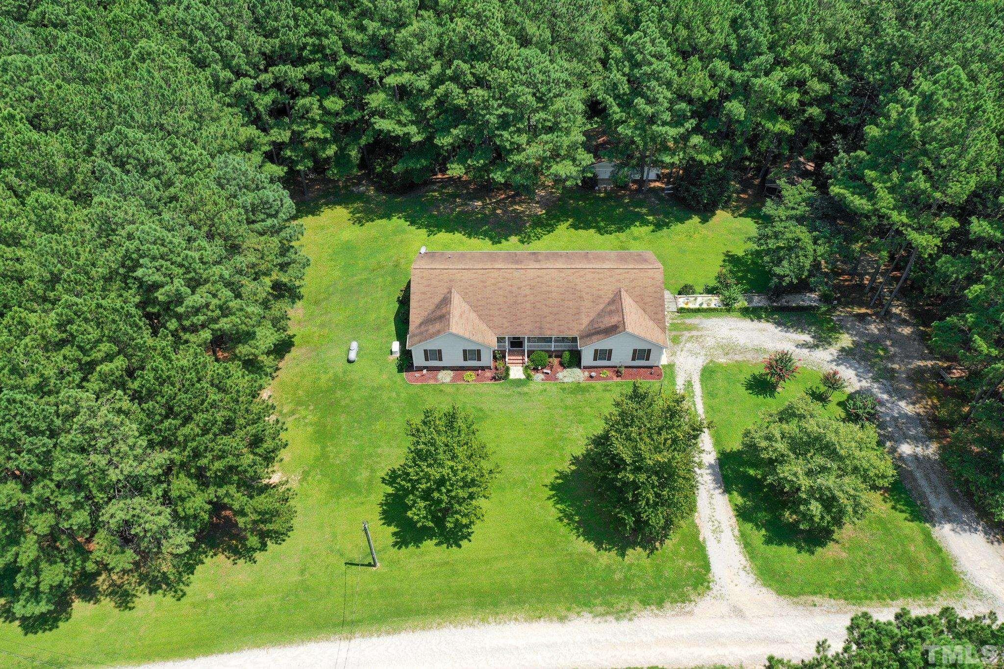191 River Ridge Lane Spring Hope, NC 27882 - Photo 1 of 28 an aerial view of a house with a yard